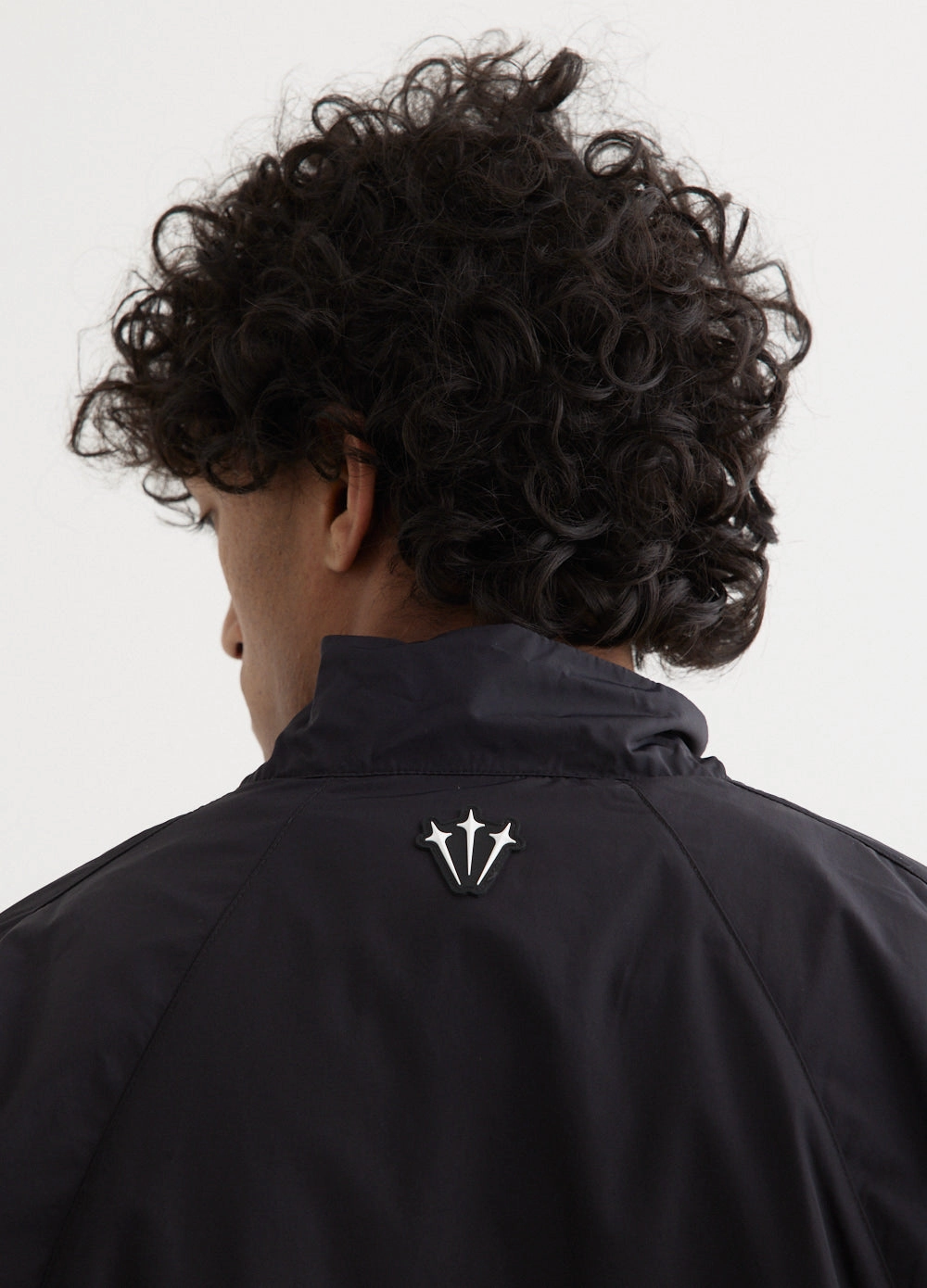 SlipResistantFastenings understated look x NOCTA NRG Woven Track Jacket